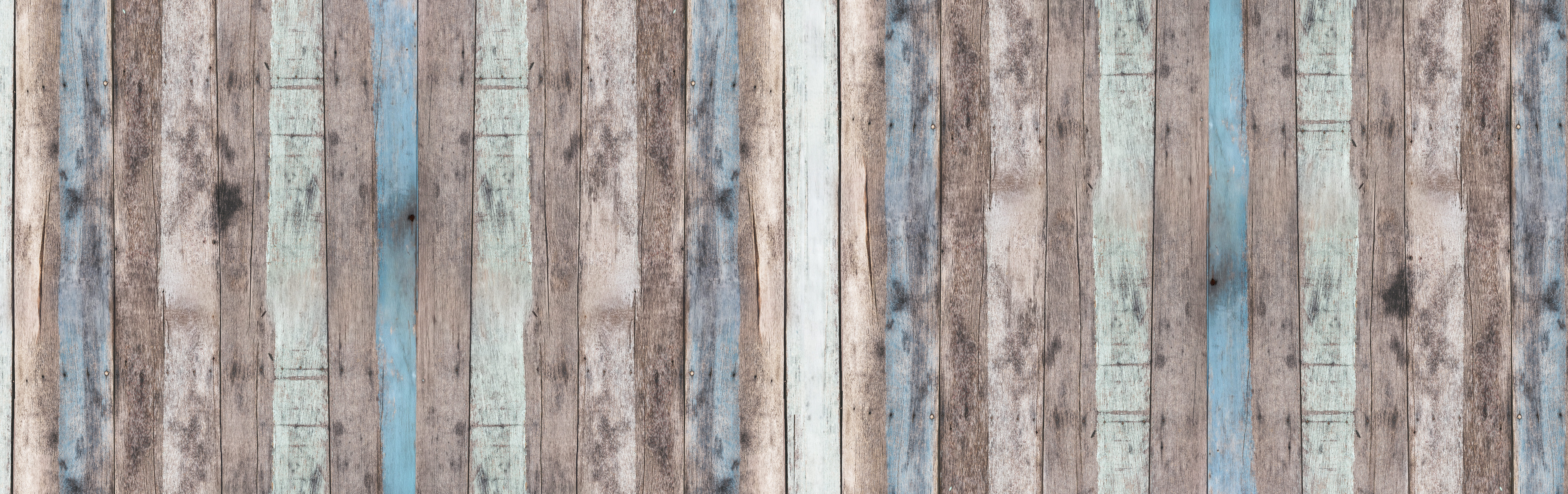 Textur von bunten Holzbrettern in Grau- und Blautönen.